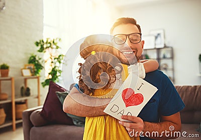 Father`s day. Happy family daughter hugging dad and laughs Stock Photo