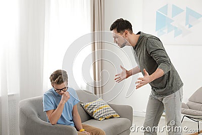 Father scolding his teenager son Stock Photo