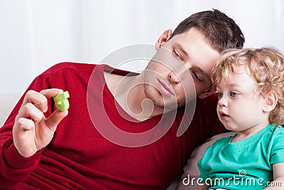 Father showing a letter to little boy Stock Photo