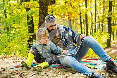 Father and son concept. Parent teach baby. Happy Father and son with spending time outdoor in the autumn park. Kid and Stock Photo