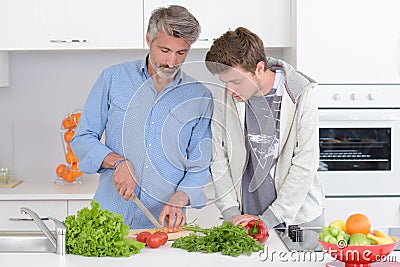 Father and son cooking Stock Photo