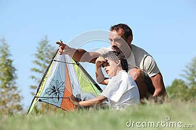 Father and son flying kite Stock Photo