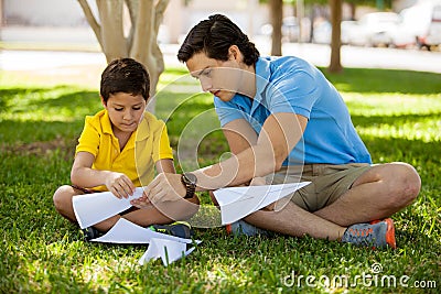 Father and son making paper planes Stock Photo