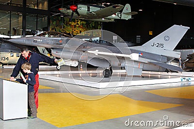 Father, little son and a J-215 fighter in the National Military Museum in Soesterberg, Soest, Netherlands Editorial Stock Photo