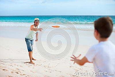 Father and son playing frisbee Stock Photo