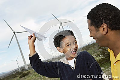 Father And Son Playing With Paper Plane Stock Photo