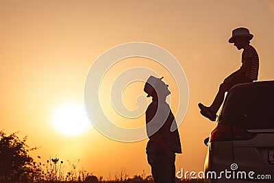 Father and son playing in the park at the sunset time. Stock Photo