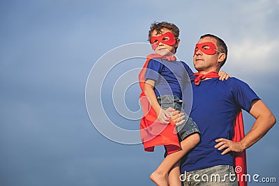 Father and son playing superhero outdoors at the day time. Stock Photo