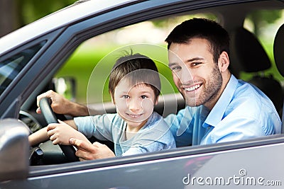 Father and son sitting in a car Stock Photo