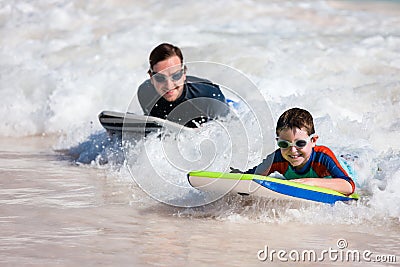 Father and son surfing Stock Photo