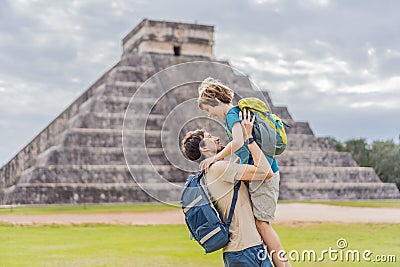 Father and son tourists observing the old pyramid and temple of the castle of the Mayan architecture known as Chichen Stock Photo