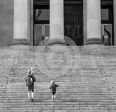 Black and white image of people walking up the steps of the Washington State Capitol building Editorial Stock Photo