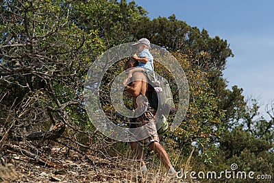 Father and son walking in mountains. Travelling background. Summer time. Trecking Stock Photo
