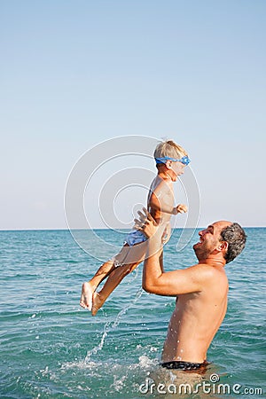 Father and son on water Stock Photo