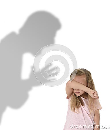 Father or teacher shadow screaming angry reproving young sweet little schoolgirl or daughter Stock Photo