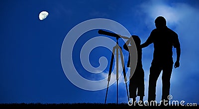 Father teaches son to look at the moon with the telescope Stock Photo