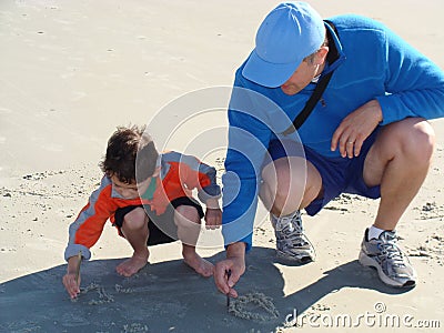 Father teaching his son to write Stock Photo