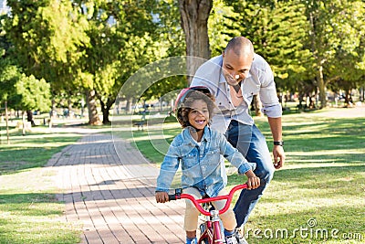 Father teaching son cycling Stock Photo