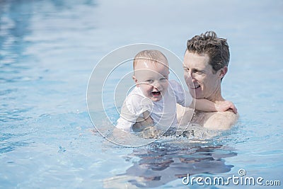 Father and Toddler Boy in Pool at a Resort in Mexico Stock Photo