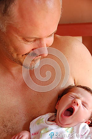 Father and yawning newborn baby Stock Photo