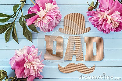 Fathers day background with cardboard letters and purple peonies Stock Photo