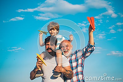 Fathers day - grandfather, father and son are hugging and having fun together. Stock Photo