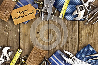 Fathers Day tag with tools and ties frame on wood Stock Photo