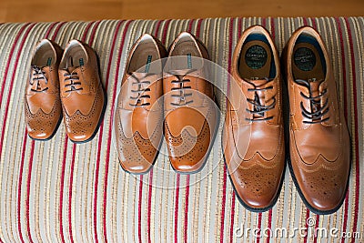 Fathers and sons new brown leather shoes Editorial Stock Photo