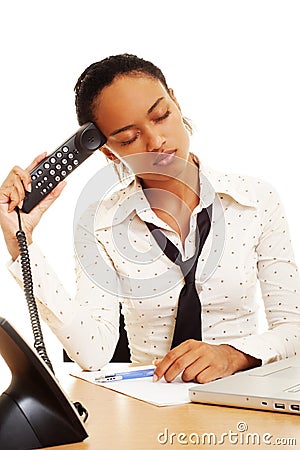 Fatigued woman with telephone Stock Photo