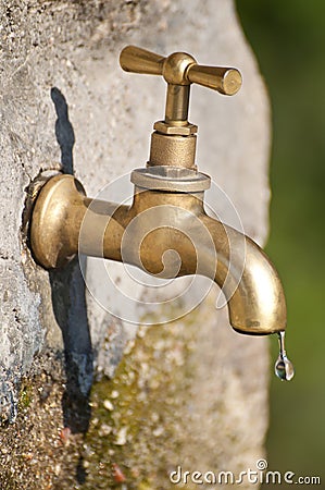 A faucet dripping Stock Photo