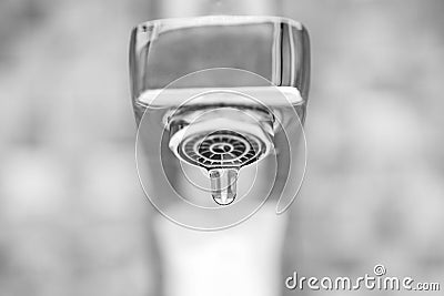 Faucet with dripping water. Tap closeup with dripping water-drop. Water leaking, saving concept Stock Photo