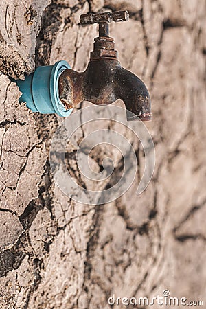 Faucets on dry ground drought and crisis environment Stock Photo