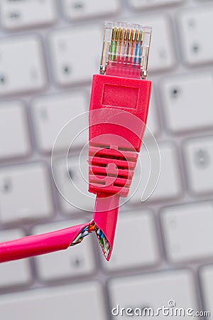 Faulty network cable on keyboard Stock Photo