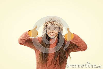 Faux fur trend. Playful fashionista. Child long hair soft fur hat enjoy softness. Soft care concept. Girl long hair wear Stock Photo