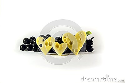 Favorite cheese and black grapes Stock Photo