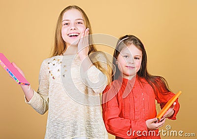 Favorite fairytale. Sisters pick books to read together. Adorable girls love books. Secret diary or personal journal Stock Photo