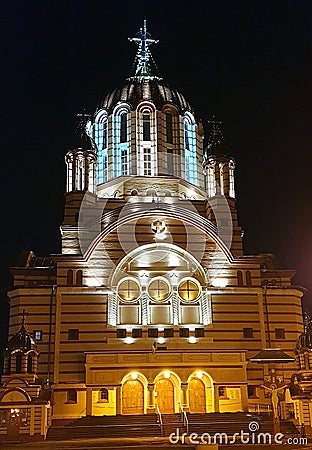 Illuminated facade of the Cathedral of John the Baptist in Fagaras, Romania Stock Photo