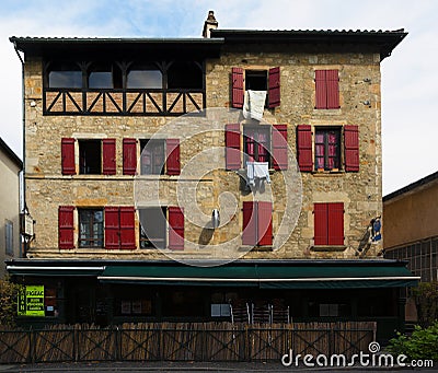 FaÃ§ade with red shutters French architecture in Figeac Stock Photo