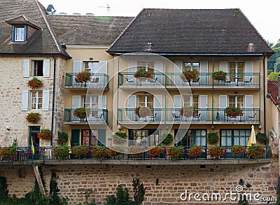 FaÃ§ade with white shutters French architecture in Figeac Stock Photo