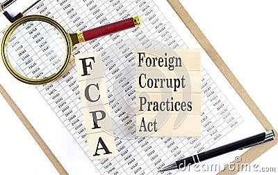 FCPA Foreign Corrupt Practices Act text on wooden block on chart background Stock Photo