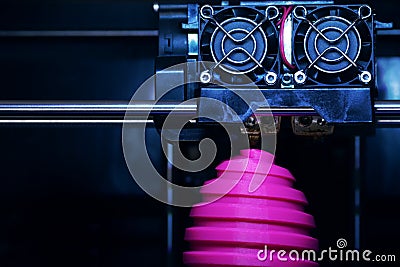 FDM 3D-printer manufacturing wound pink easter egg sculpture - front view on object and print head Stock Photo