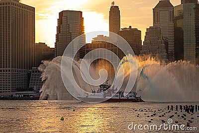 FDNY boat sprays red, white, and blue water ahead of Macy`s 4th of July Fireworks Editorial Stock Photo