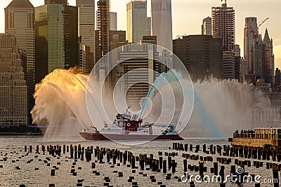 FDNY boat sprays red, white, and blue water ahead of Macy`s 4th of July Fireworks Editorial Stock Photo