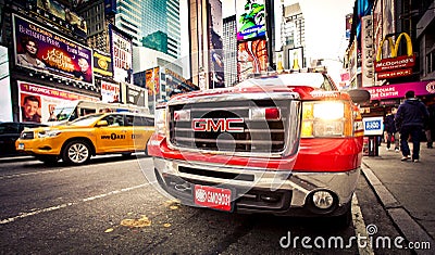 FDNY car and taxi car on Times Square Editorial Stock Photo
