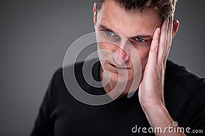 Fear/anxiety/regret/uncertainty in a young man Stock Photo