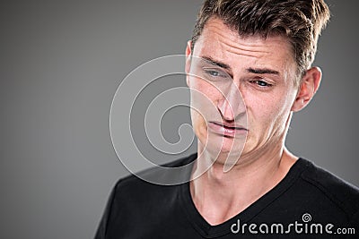 Fear/anxiety/regret/uncertainty in a young man Stock Photo