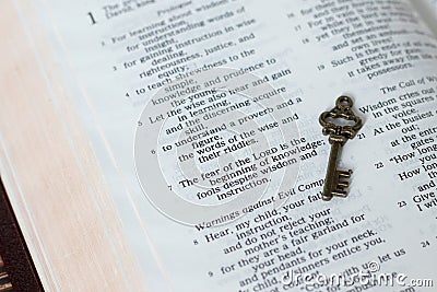 Fear of the LORD is the beginning of wisdom verse, proverbs bible book with ancient key. Stock Photo