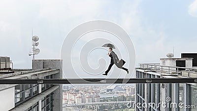 Fearless businessman overcoming difficulty. Mixed media . Mixed media Stock Photo