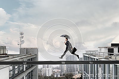 Fearless businessman overcoming difficulty. Mixed media . Mixed media Stock Photo