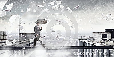 Fearless businessman overcoming difficulty. Mixed media . Mixed media Stock Photo